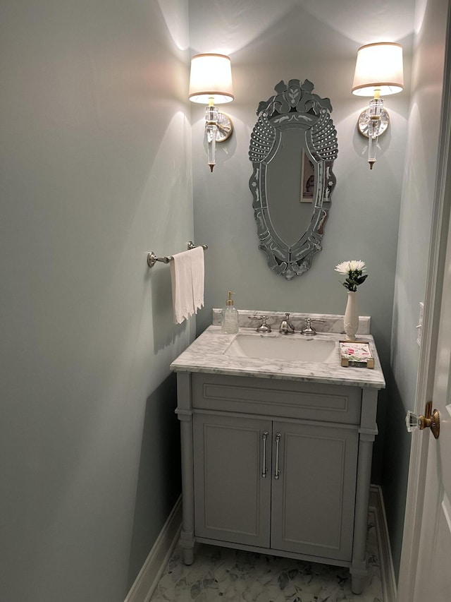3998 Capensis Ln, Ravenel, SC 29470 - bathroom with marble look tiles, vanity, and baseboards