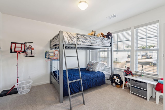 bedroom with light carpet, baseboards, and visible vents