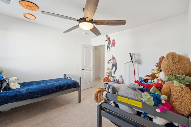 bedroom with light carpet and ceiling fan