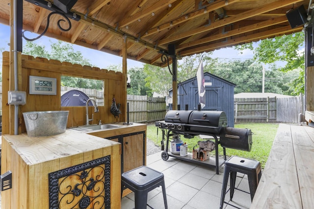 414 Birch Ave, Goose Creek, SC 29445 - fenced backyard with a patio area, grilling area, and a shed