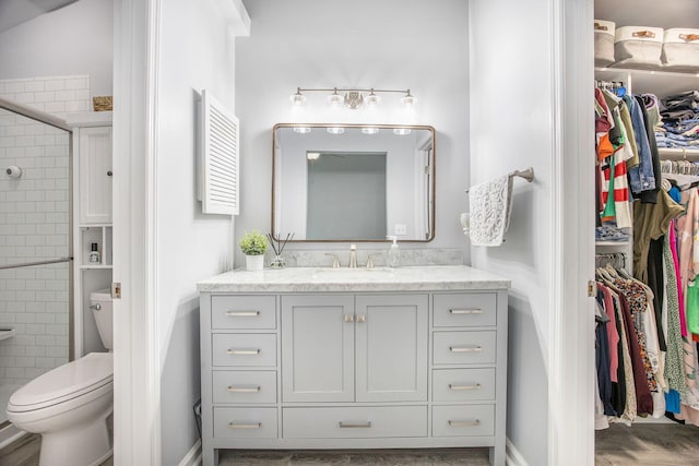 512 Castle Hall Rd, Mount Pleasant, SC 29464 - full bath with a spacious closet, vanity, a stall shower, wood finished floors, and toilet
