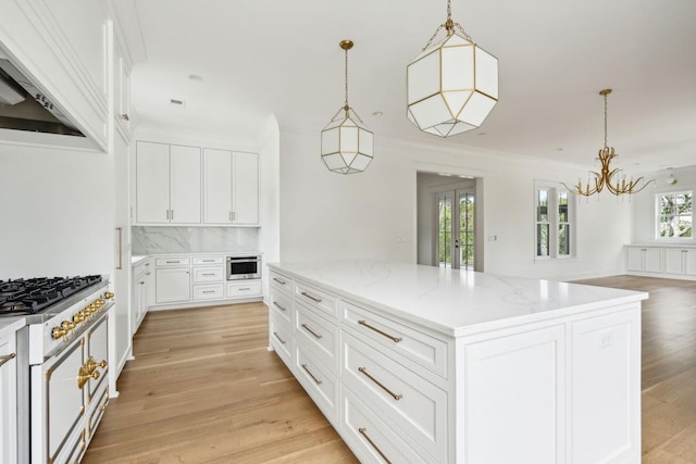 1479 Jeremy Cay Ct, Awendaw, SC 29429 - kitchen with premium range hood, a kitchen island, decorative backsplash, a chandelier, and light wood finished floors