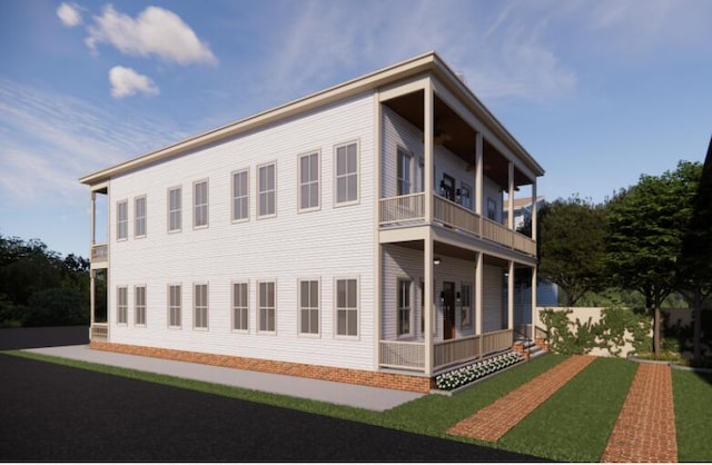 rear view of property featuring covered porch and a balcony