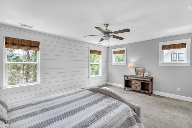 bedroom featuring a ceiling fan, carpet, visible vents, and baseboards