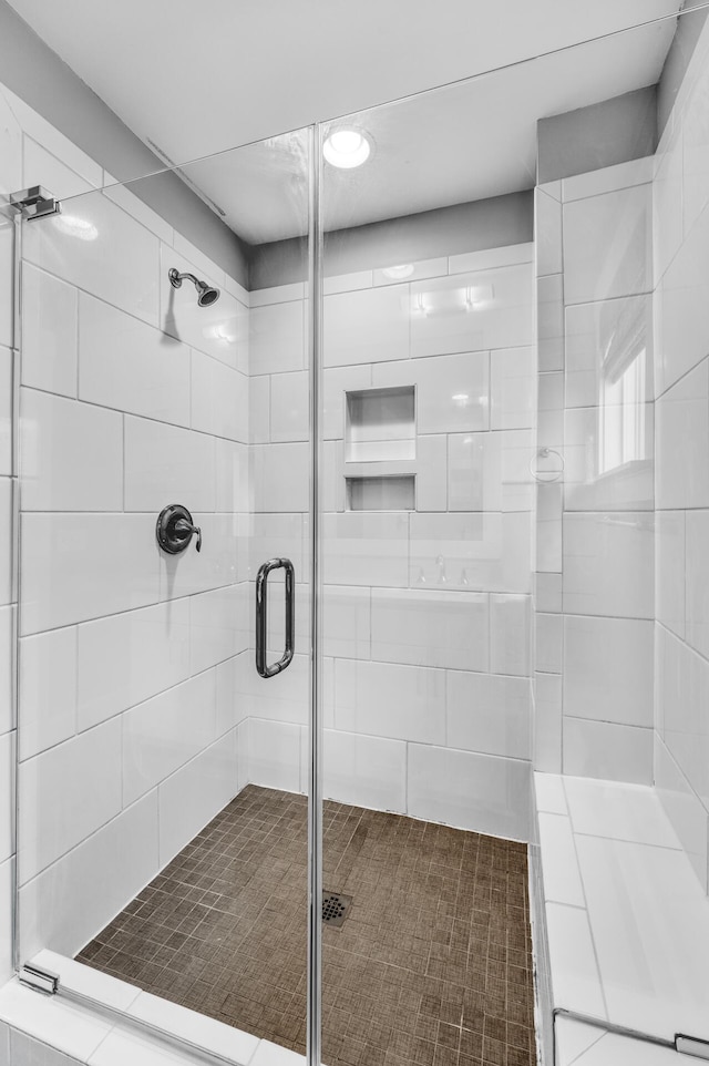 full bathroom with a shower stall