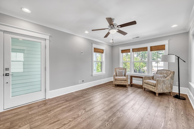 unfurnished room featuring baseboards, recessed lighting, wood finished floors, and crown molding