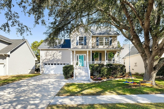 colonial home with a garage, covered porch, driveway, and a front lawn