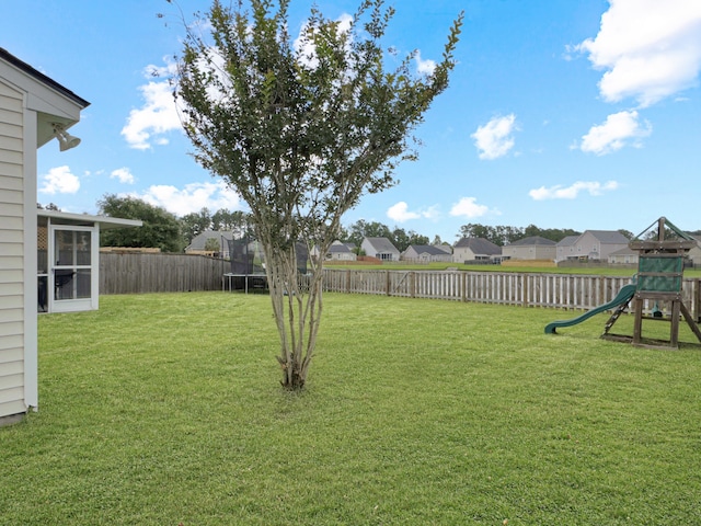 224 Market Hall St, Moncks Corner, SC 29461 - view of yard featuring a trampoline, a residential view, and a playground