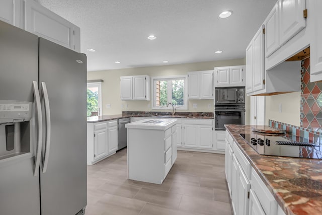 919 Overview Ct, Mount Pleasant, SC 29464 - kitchen featuring black appliances, recessed lighting, white cabinetry, a center island, and a sink