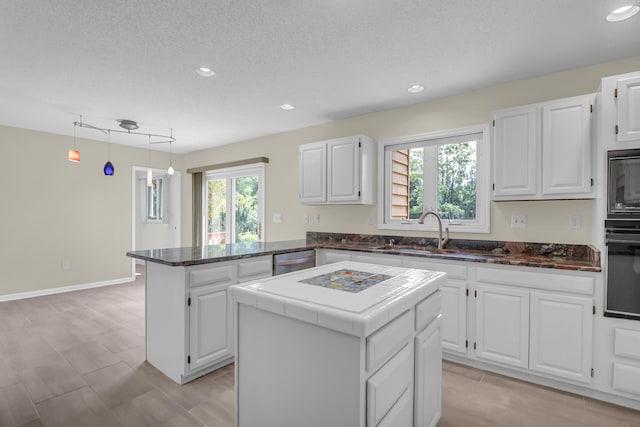 919 Overview Ct, Mount Pleasant, SC 29464 - kitchen featuring a sink, black appliances, a peninsula, white cabinets, and recessed lighting