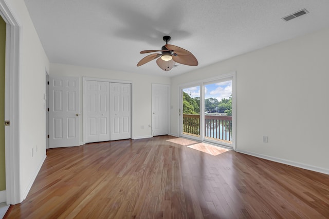 919 Overview Ct, Mount Pleasant, SC 29464 - unfurnished bedroom featuring access to exterior, baseboards, wood finished floors, and a ceiling fan