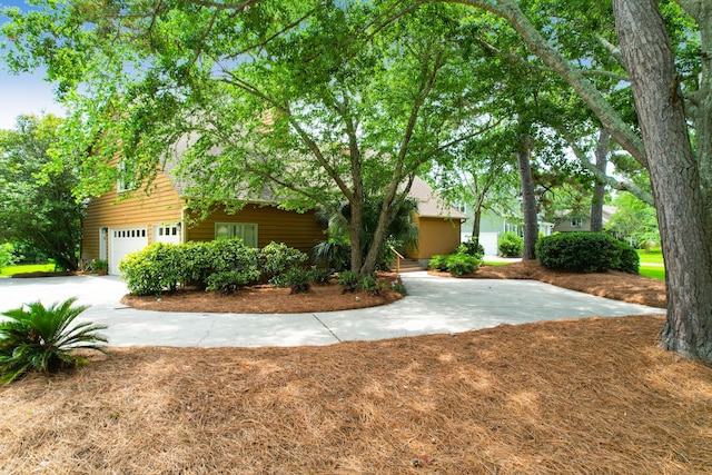 919 Overview Ct, Mount Pleasant, SC 29464 - view of property hidden behind natural elements with a garage and driveway