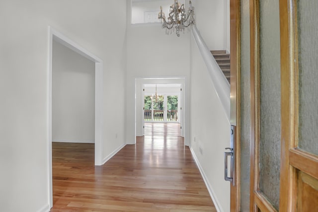 919 Overview Ct, Mount Pleasant, SC 29464 - foyer entrance featuring a chandelier, light wood-style floors, stairs, baseboards, and a high ceiling