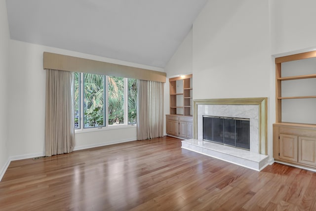 919 Overview Ct, Mount Pleasant, SC 29464 - unfurnished living room featuring wood finished floors, high vaulted ceiling, baseboards, and a fireplace