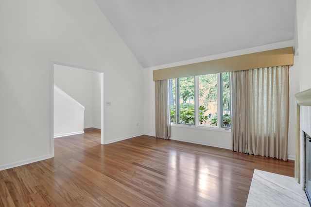 919 Overview Ct, Mount Pleasant, SC 29464 - unfurnished living room featuring high vaulted ceiling, wood finished floors, and baseboards