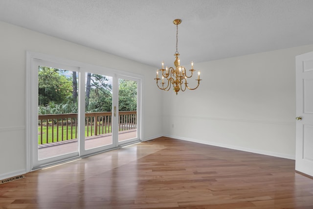 919 Overview Ct, Mount Pleasant, SC 29464 - spare room featuring wood finished floors, a chandelier, and baseboards
