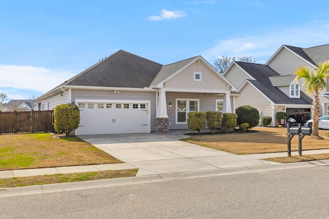 view of front of home with a garage and a front yard