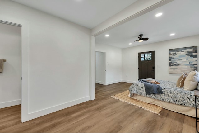 bedroom with hardwood / wood-style flooring