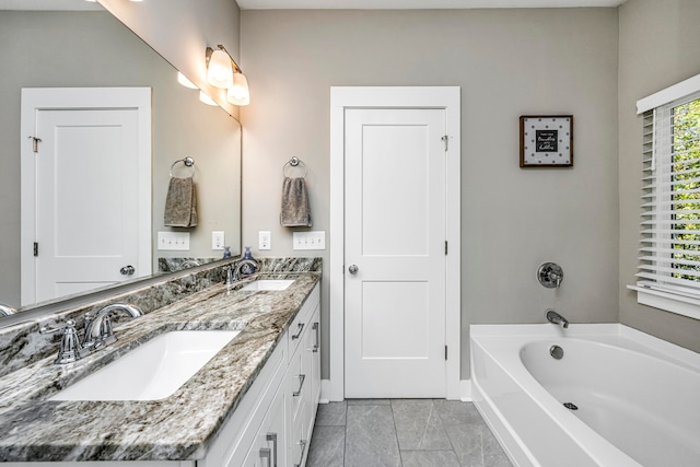 bathroom with vanity and a bathtub