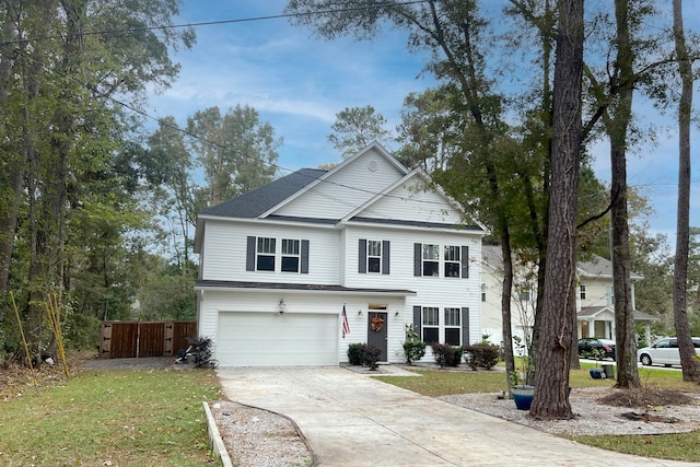 view of front property featuring a front yard and a garage