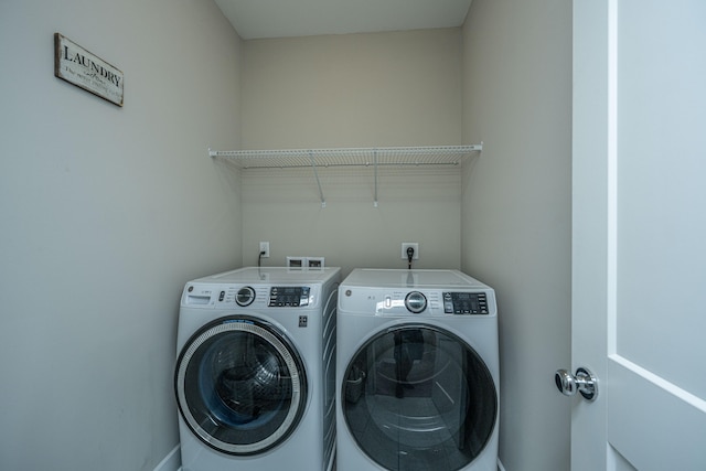 washroom featuring washer and dryer