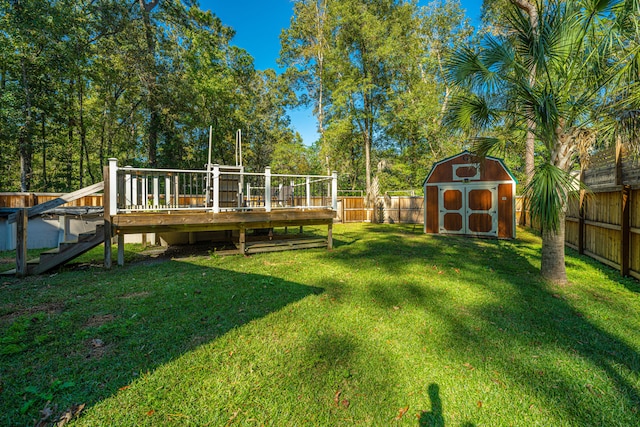 view of yard featuring a shed and a wooden deck