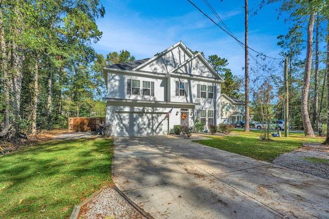 view of front property featuring a front lawn and a garage