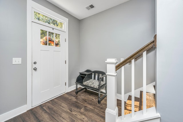 entryway with dark hardwood / wood-style floors