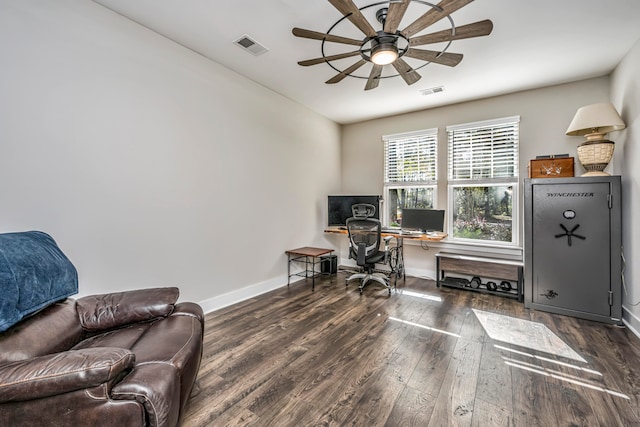 home office featuring dark hardwood / wood-style floors and ceiling fan