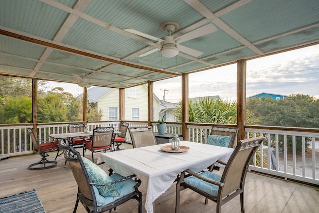 sunroom / solarium featuring ceiling fan and plenty of natural light