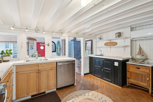 kitchen with sink, light hardwood / wood-style flooring, dishwasher, and beam ceiling