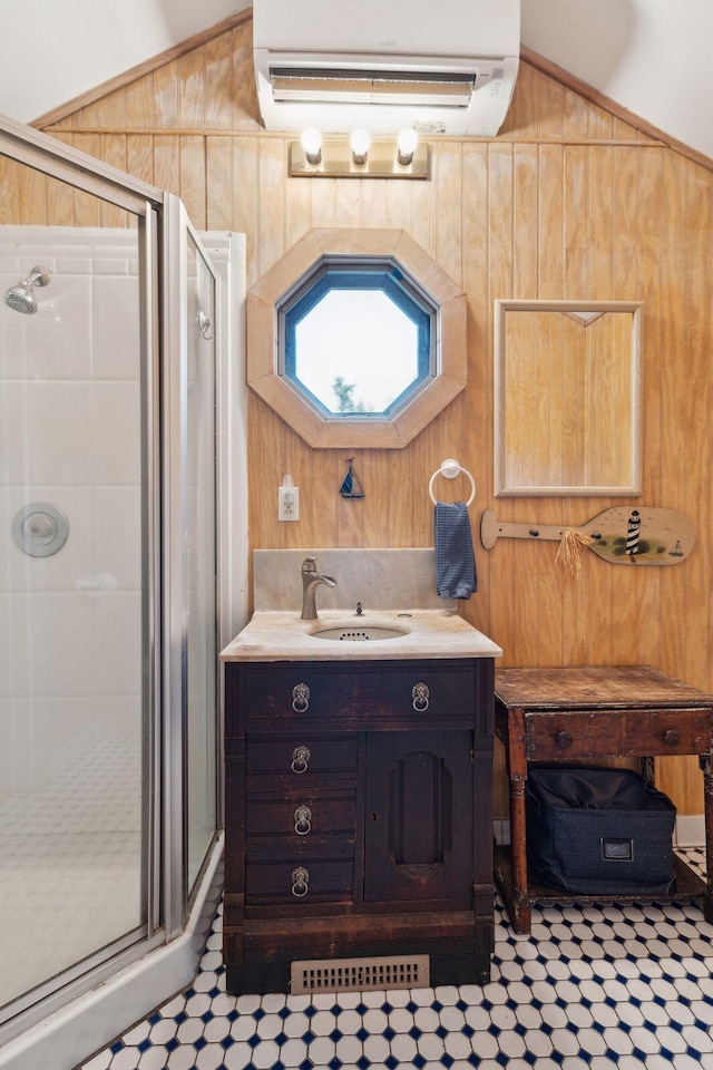 bathroom with lofted ceiling, a wall unit AC, and wood walls