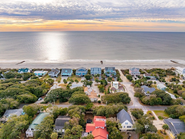 aerial view at dusk with a water view