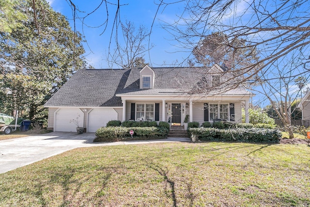 cape cod-style house with an attached garage, concrete driveway, roof with shingles, and a front yard