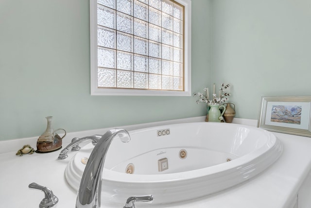 full bath featuring a tub with jets