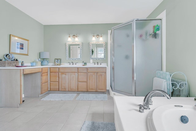 bathroom featuring double vanity, tile patterned floors, a sink, and a shower stall