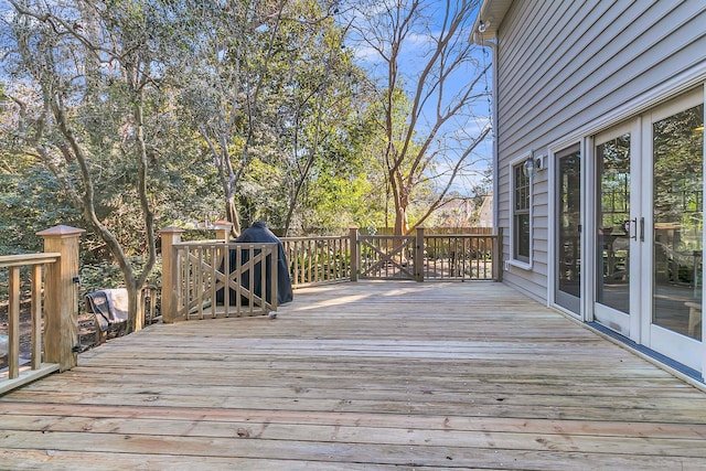 wooden deck featuring french doors