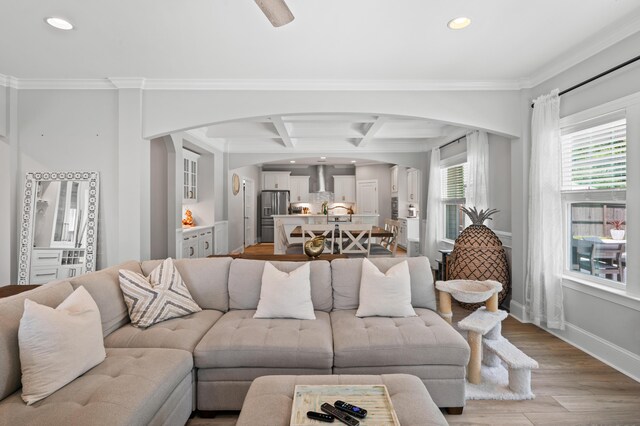 2802 Cavalcade Cir, Johns Island, SC 29455 - living area featuring arched walkways, recessed lighting, coffered ceiling, light wood-style floors, and ornamental molding