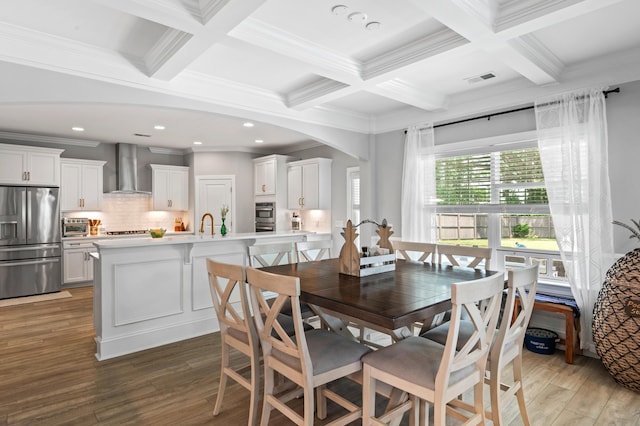 2802 Cavalcade Cir, Johns Island, SC 29455 - dining space featuring coffered ceiling, arched walkways, beamed ceiling, light wood-style floors, and ornamental molding