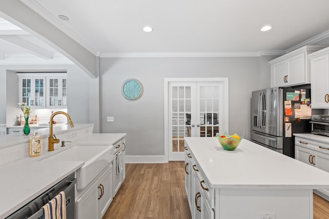 2802 Cavalcade Cir, Johns Island, SC 29455 - kitchen with stainless steel appliances, french doors, a sink, crown molding, and light wood-style floors
