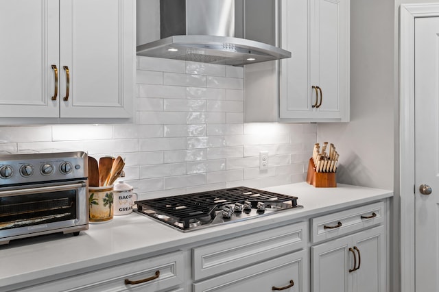 2802 Cavalcade Cir, Johns Island, SC 29455 - kitchen with wall chimney exhaust hood, stainless steel gas cooktop, light countertops, white cabinets, and tasteful backsplash