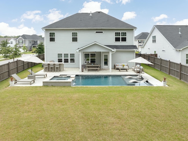2802 Cavalcade Cir, Johns Island, SC 29455 - back of property featuring outdoor lounge area, a patio area, a pool with connected hot tub, and roof with shingles