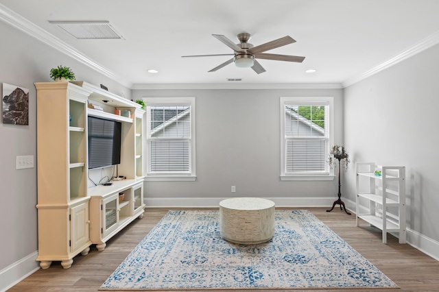 2802 Cavalcade Cir, Johns Island, SC 29455 - living area with light wood finished floors, ceiling fan, baseboards, ornamental molding, and recessed lighting