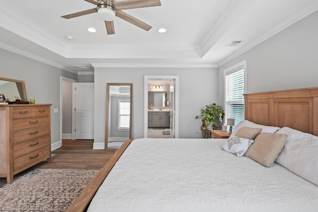 2802 Cavalcade Cir, Johns Island, SC 29455 - bedroom with multiple windows, wood finished floors, a raised ceiling, crown molding, and baseboards