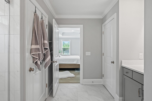2802 Cavalcade Cir, Johns Island, SC 29455 - ensuite bathroom with ornamental molding, marble look tile flooring, vanity, and baseboards