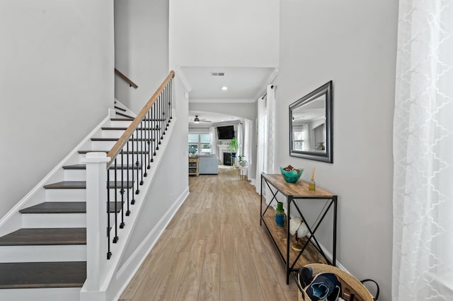 2802 Cavalcade Cir, Johns Island, SC 29455 - foyer entrance featuring light wood-type flooring, ceiling fan, stairs, baseboards, and a high ceiling