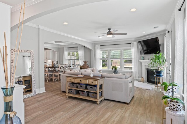 2802 Cavalcade Cir, Johns Island, SC 29455 - living area featuring arched walkways, ceiling fan, ornamental molding, light wood-style flooring, and recessed lighting