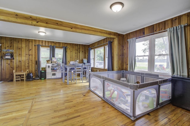 interior space featuring ornamental molding and light wood finished floors