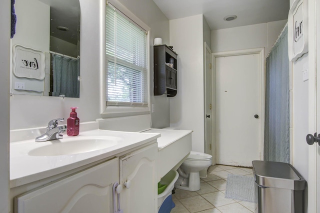 full bathroom featuring tile patterned flooring, vanity, and toilet