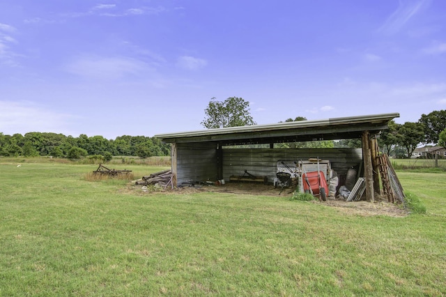 view of pole building with a yard